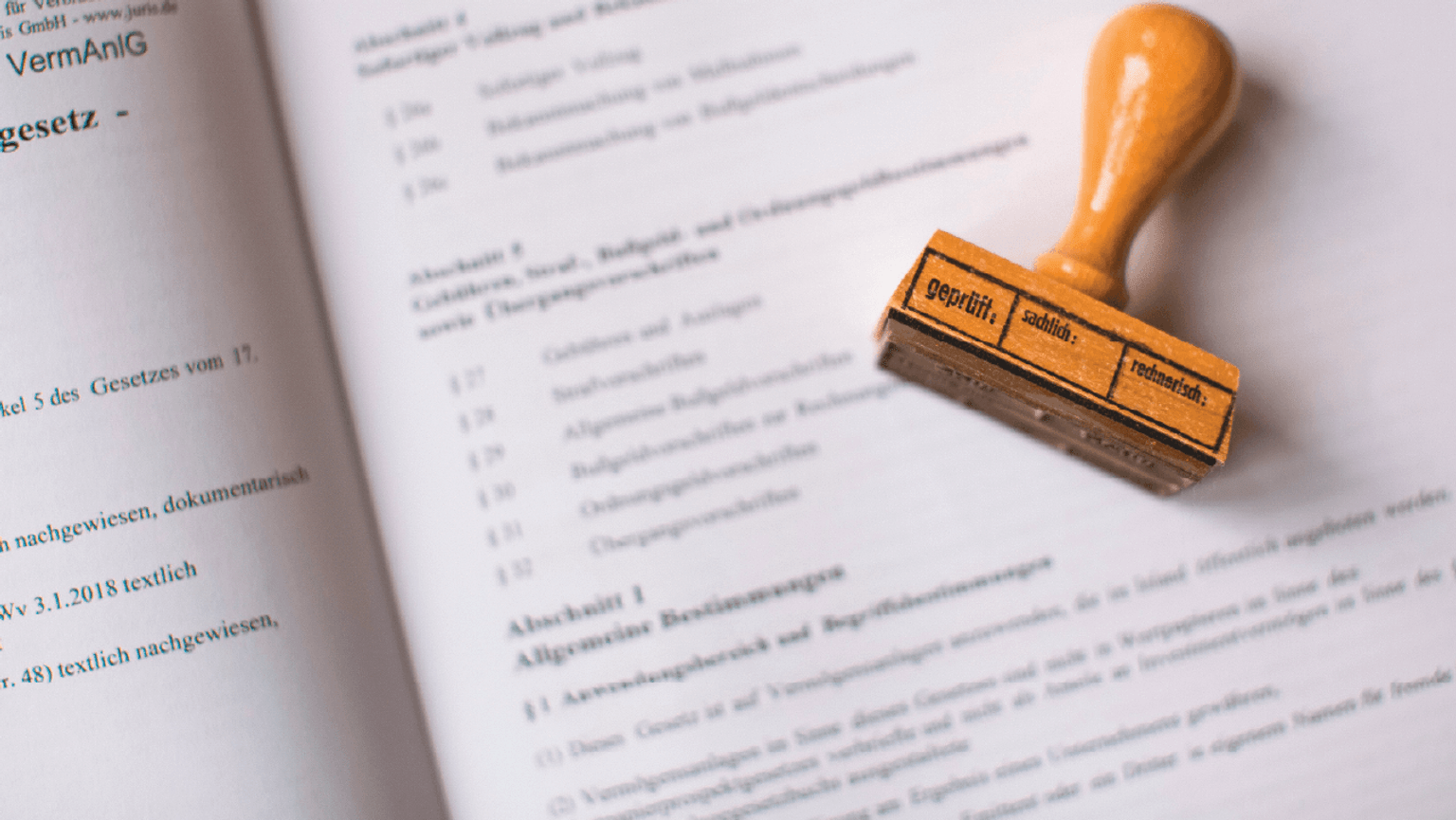 Paperwork with a rubber stamp sitting on top